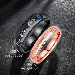 Close-up of black and rose gold Her King His Queen crown couple rings with zirconia