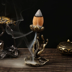 Bruciatore di incenso a riflusso loto vintage con mano di Buddha e base a foglia di bronzo