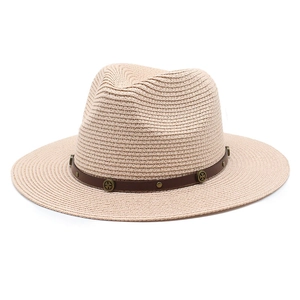 Beige straw fedora with brown leather band and metallic studs for outdoor beach sun protection