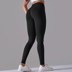 Detailed back view of seamless high-waisted black yoga leggings with peach butt-lifting design