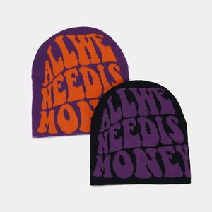 Detailed knit texture of Y2K beanies featuring bold All We Need Is Money jacquard text