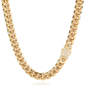 Detailed view of golden Cuban link chain with a sparkling cubic zirconia spring clasp