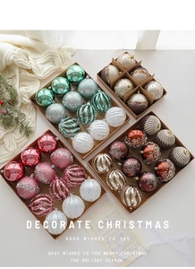 Detail of glitter and patterned 8cm Christmas ball ornaments in festive gift boxes