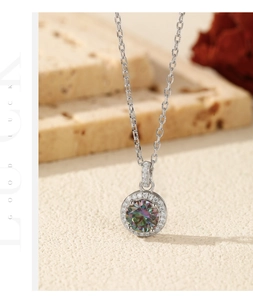 Macro detail of 1 carat colorful moissanite pendant with halo zircons and silver chain