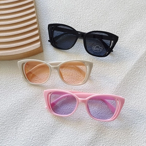 Kids trendy cat-eye sunglasses with UV400 protection in black, cream, and pink