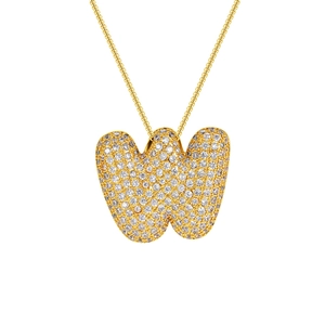 Macro detail of 18K gold plated letter W pendant with sparkling zircon inlays