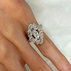 Macro detail of silver ring featuring marquise-cut zircon in a luxury floral cluster setting