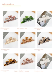 Macro detail of tortoiseshell and marble acetate bow claw clips in various colors