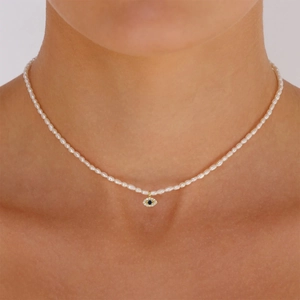 Close-up of S925 silver evil eye pendant necklace with rice freshwater pearls and blue gems