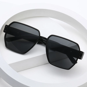 Modern oversized black geometric sunglasses with thick frame and dark lenses