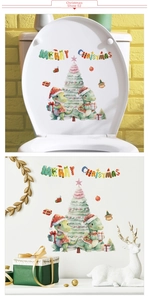 Close-up of Christmas stickers with dinosaur and Merry Christmas banner for wall decor