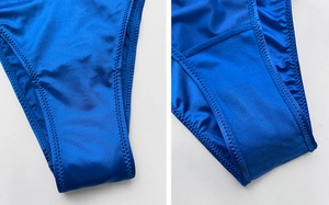 Detail of high-elasticity satin fabric and premium stitching on blue ice silk underwear