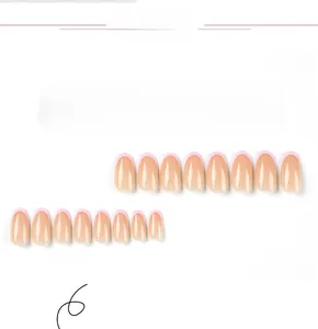Detail of 24pcs pink French tip press-on nails with short round shape and glossy finish