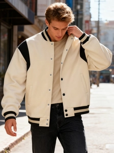 Close-up of a classic varsity jacket with silver snap buttons and black ribbed collar details