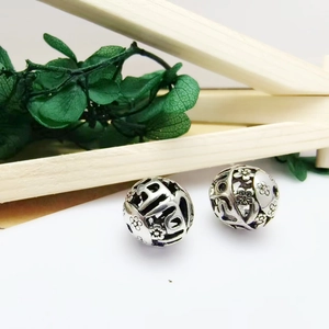 Tibetan silver retro hollow spherical beads with heart and floral patterns for bracelets
