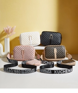 Detail of four patterned crossbody bags with wide jacquard straps and round coin purses