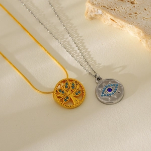 Gold leaf and evil eye pendants on snake chain necklace for women in elegant setting