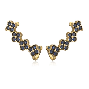 Elegant gold clover crawler earrings with sparkling dark blue round-cut gemstones