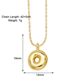 Detailed view of a gold-plated doughnut pendant necklace with 42+5cm chain measurements