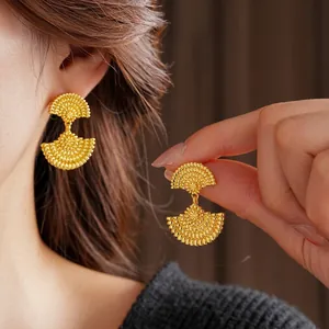 Vintage gold plated double fan earrings with textured grain finish and stud closure