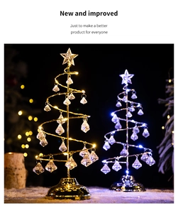 Detailed view of spiral crystal Christmas tree lights with star topper and warm LED glow