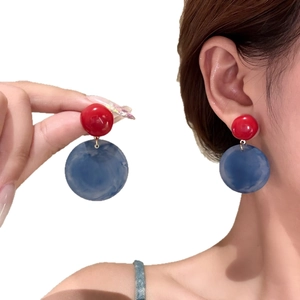 Minimalist geometric round acrylic earrings in red and blue color block design