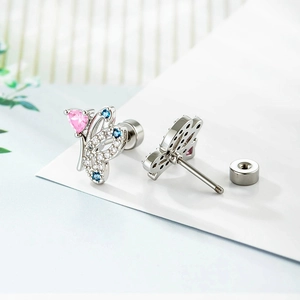 Luxury butterfly stud earring with pink heart gemstone and screw back closure in silver