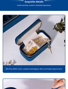 Macro detail of portable velvet jewelry box with organized interior for earrings and necklaces
