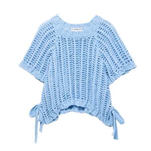 Detail of light blue knit top featuring hollow-out texture and side bow tie-up straps