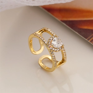 Macro shot of gold adjustable ring featuring heart-shaped zircon and double-row pavé crystals