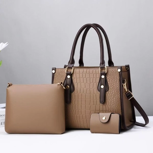 Detailed view of the 3-in-1 stone texture handbag set with elegant gold hardware