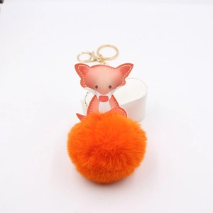 Süßer Fuchs-Anhänger aus Leder mit leuchtend orangefarbenem Plüsch-Pompon und goldenem Schlüsselanhänger