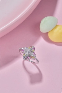 Close-up of S925 sterling silver flower ring featuring colorful zircon pavé setting