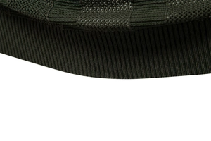 Macro detail of dark green knit fabric showing premium ribbed cuffs and hem texture