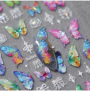 Macro view of 3D laser butterfly nail stickers with colorful holographic effects