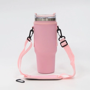 Adjustable pink silicone cup sleeve with shoulder strap and black clip for 40oz tumblers