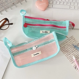 Close-up of double-layer mesh pencil case with zip and handle in macaron colors