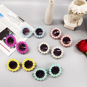Daisy shaped floral kids sunglasses in multiple pastel colors for summer UV protection