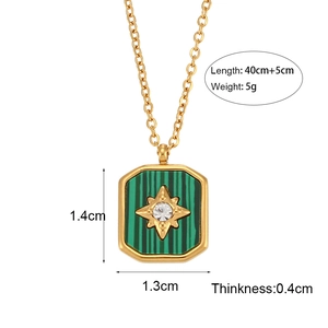 Golden necklace with green striped square pendant and star detail on white background