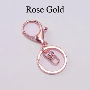 Detail of rose gold lobster clasp keychain set with swivel link and flat split ring