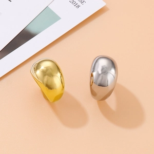 Polished gold and silver stainless steel rings with minimalist dome drop design