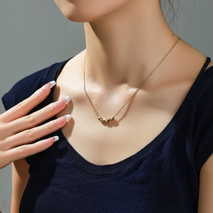 Minimalist 14k gold plated snake chain necklace featuring three sleek bean pendants