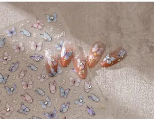 Detailed butterfly nail stickers with rhinestones and gradients on matte background
