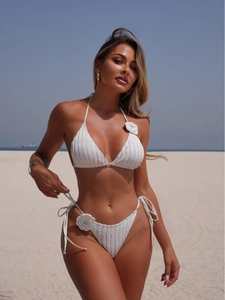 White knit bikini set with 3D floral accents and halter neck tie for women's beachwear