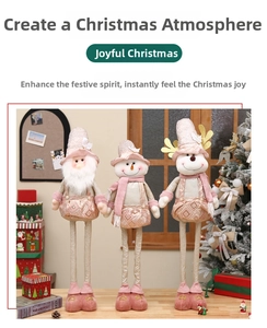 Detailed close-up of retractable pink Christmas plush figures featuring sequins and knits