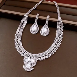 Elegant rhinestone water drop jewelry set with necklace and drop earrings on a display box