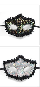 Detail of sequined masquerade masks with dragon patterns and faux diamond edges