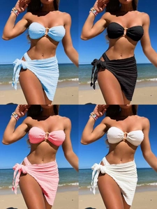 Detail of textured bandeau bikini set with metal ring and matching beach sarong in four colors