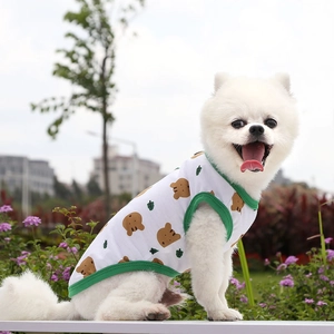 Breathable cotton pet vest for small dogs featuring cute cartoon bear print and green trim