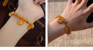 Detail of 24k gold plated bangle with enamel pendants and matching wavy ring set